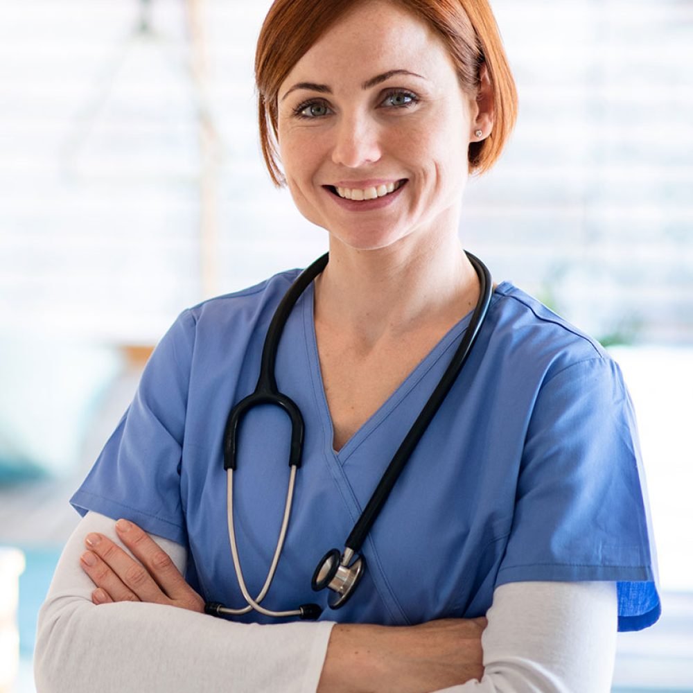 portrait-of-female-doctor-or-nurse-standing-in-hos-J37Z55D.jpg